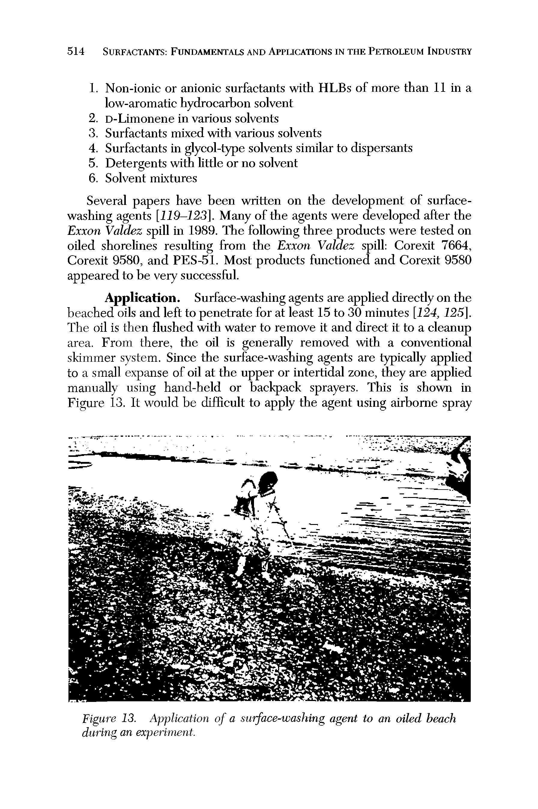 Figure 13. Application of a surface-washing agent to an oiled beach during an experiment.