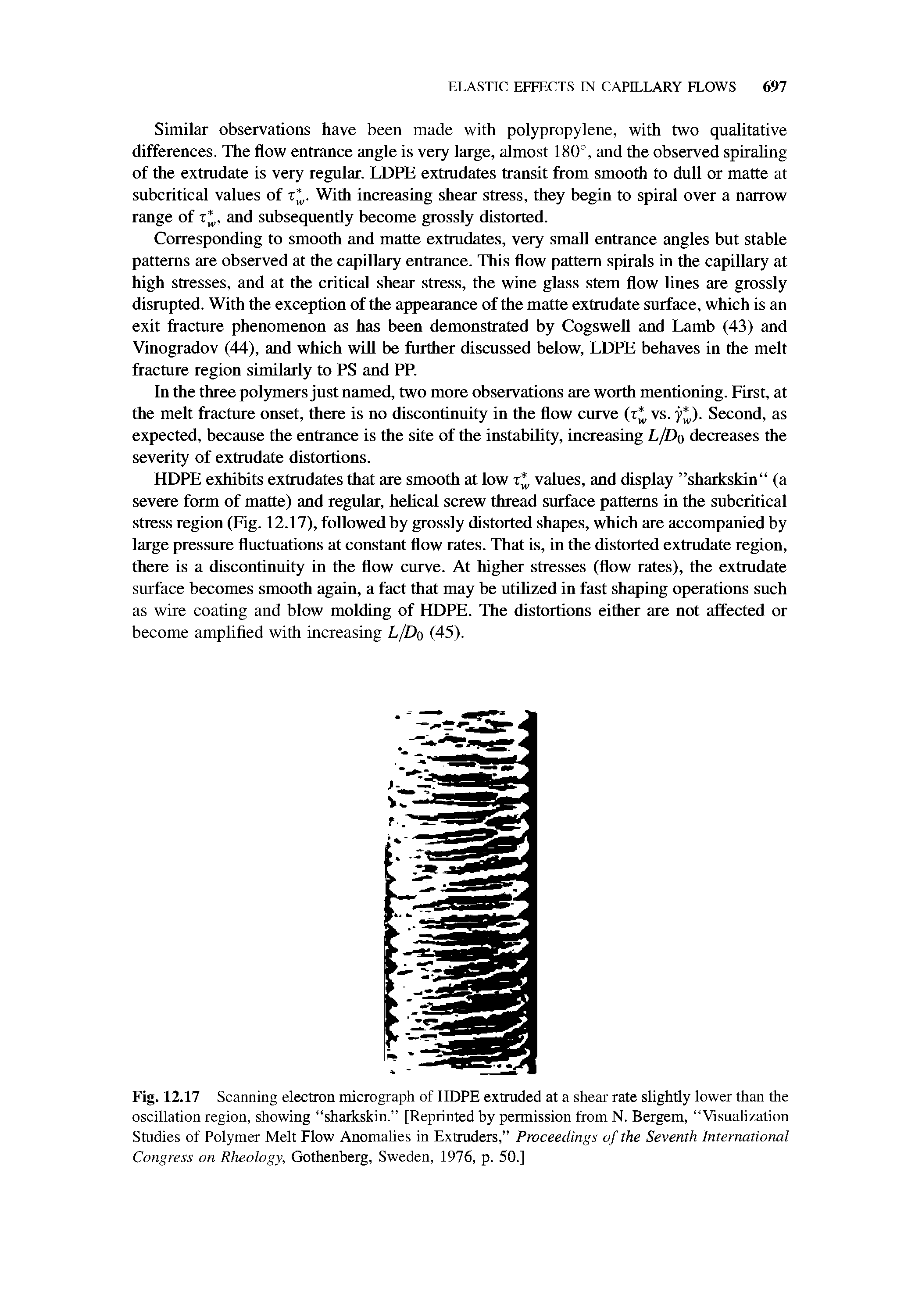 Fig. 12.17 Scanning electron micrograph of HDPE extruded at a shear rate slightly lower than the oscillation region, showing sharkskin. [Reprinted by permission from N. Bergem, Visualization Studies of Polymer Melt Flow Anomalies in Extruders, Proceedings of the Seventh International Congress on Rheology, Gothenberg, Sweden, 1976, p. 50.]...